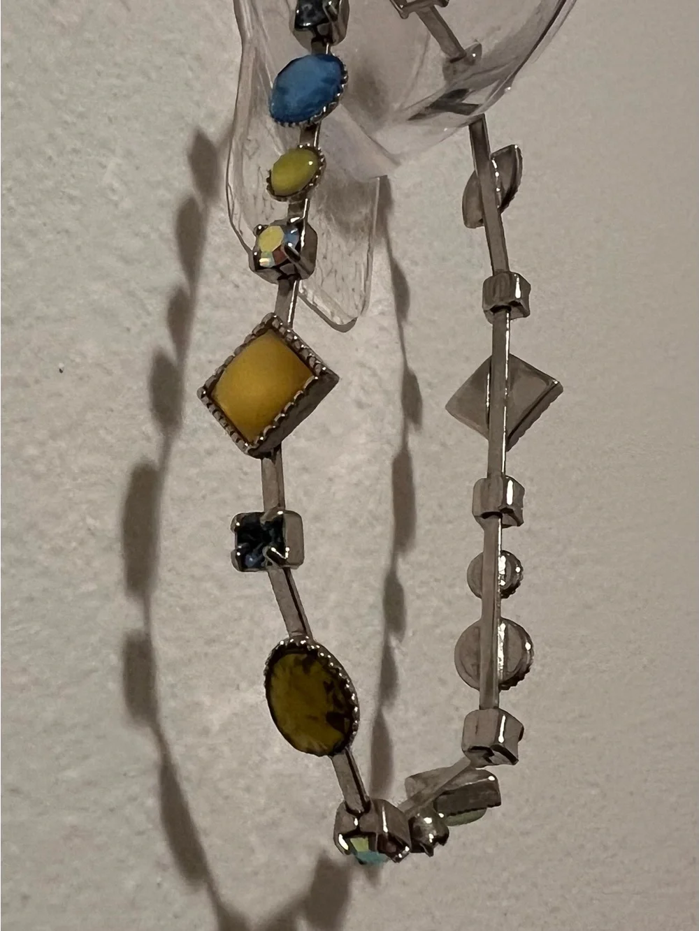Lia Sophia Cache Silver Necklace and matching brac with Blue and Yellow Accents